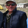 bhradio > Cho Oyu Base Camp 2007

Naim Logic has over 30 years of mountaineering and climbing experience. 
He was a member of several expeditions in Europe, Asia, and South America:
Tien Shan ‘91
Andes ‘86
Ararat / Damavend ’84   …,

and climbed the following peaks:
Khan Tengri		22,998 ft – 7,010 m
Aconcagua		22,841 ft – 6.962 m
Ama Dablam		22,493 ft – 6.856 m
Huascaran Sur	        22,804 ft – 6,768 m
Ranrapalca		20,217 ft – 6,162 m
Tocllaraju		19,790 ft – 6,032 m
Alpamayo		19,511 ft – 5,947 m
Kilimanjaro             19,340 ft - 5,895 m
Damavend		18,606 ft – 5,671 m
Ararat			16,854 ft – 5,137 m
Alam Kooh		15,912 ft – 4,850 m
Mount Blanc		15,774 ft – 4,808 m
Monte Rosa		15,203 ft – 4,634 m
Lyskamm		        14,852 ft – 4,527 m
Matterhorn		14,692 ft – 4,478 m   ….

He lives in Arizona with his wife and daughter.
Naim Logic works for an Arizona public power utility company. 
Naim has a Ph.D. in Electrical Engineering and is a registered 
Professional Engineer in the state of Arizona.